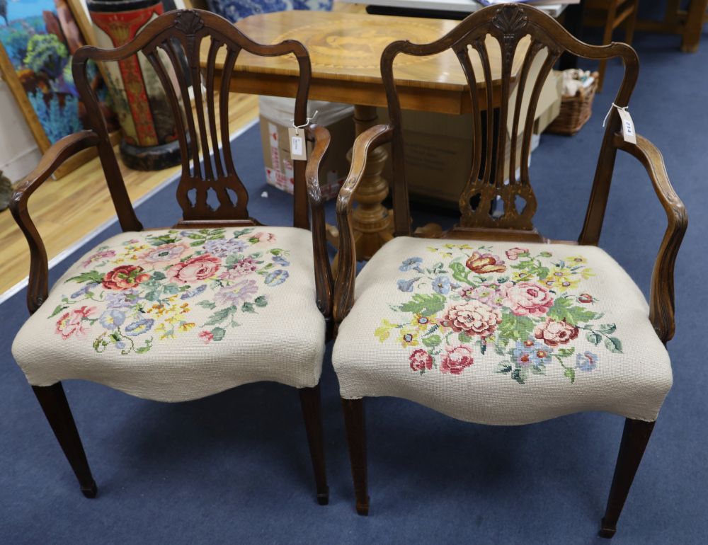 A pair of Hepplewhite style mahogany open armchairs